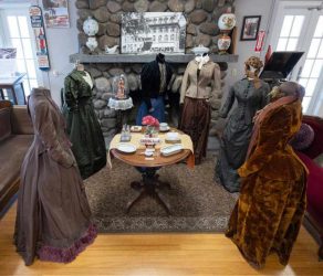 Six period dress collection on mannequins.